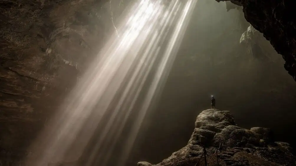 Heavenly light beam entering Jomblang Cave from above