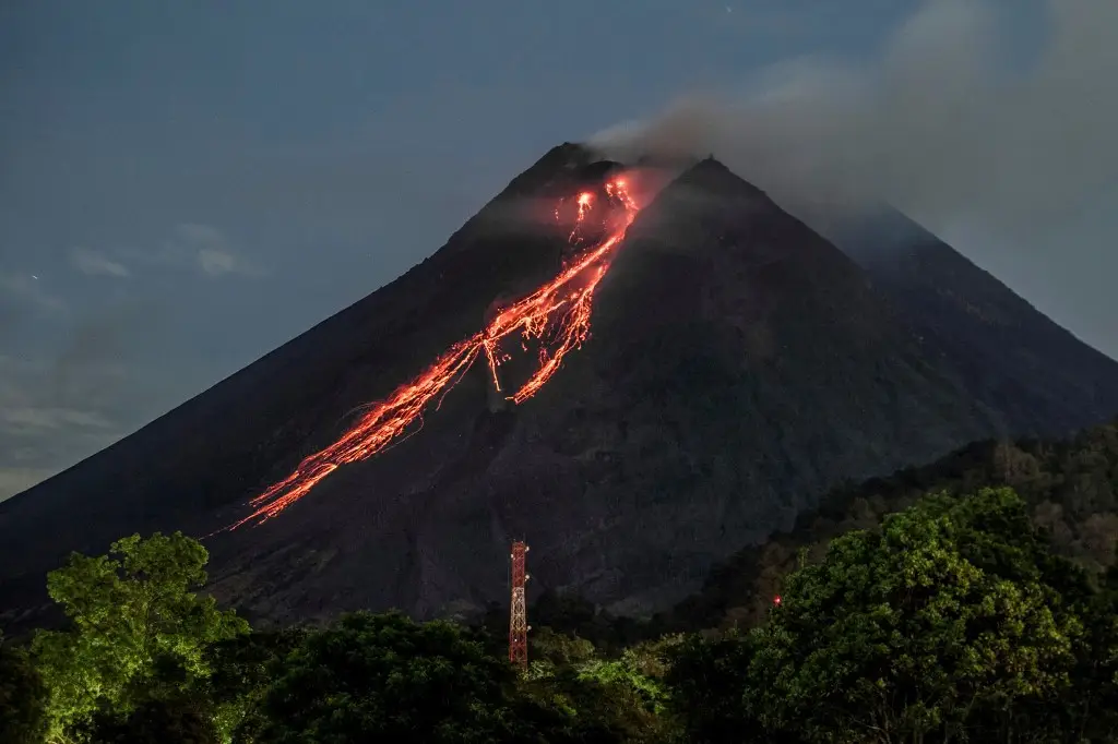 Glowing lava flowing down Mount Merapi slopes