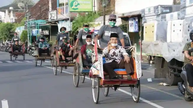 People riding becaks